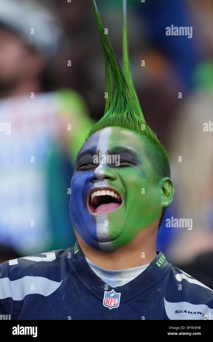 A Seattle Seahawks fan smiles during an NFL football game between the ...