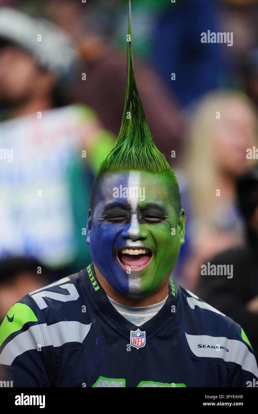 A Seattle Seahawks fan smiles during an NFL football game between the ...