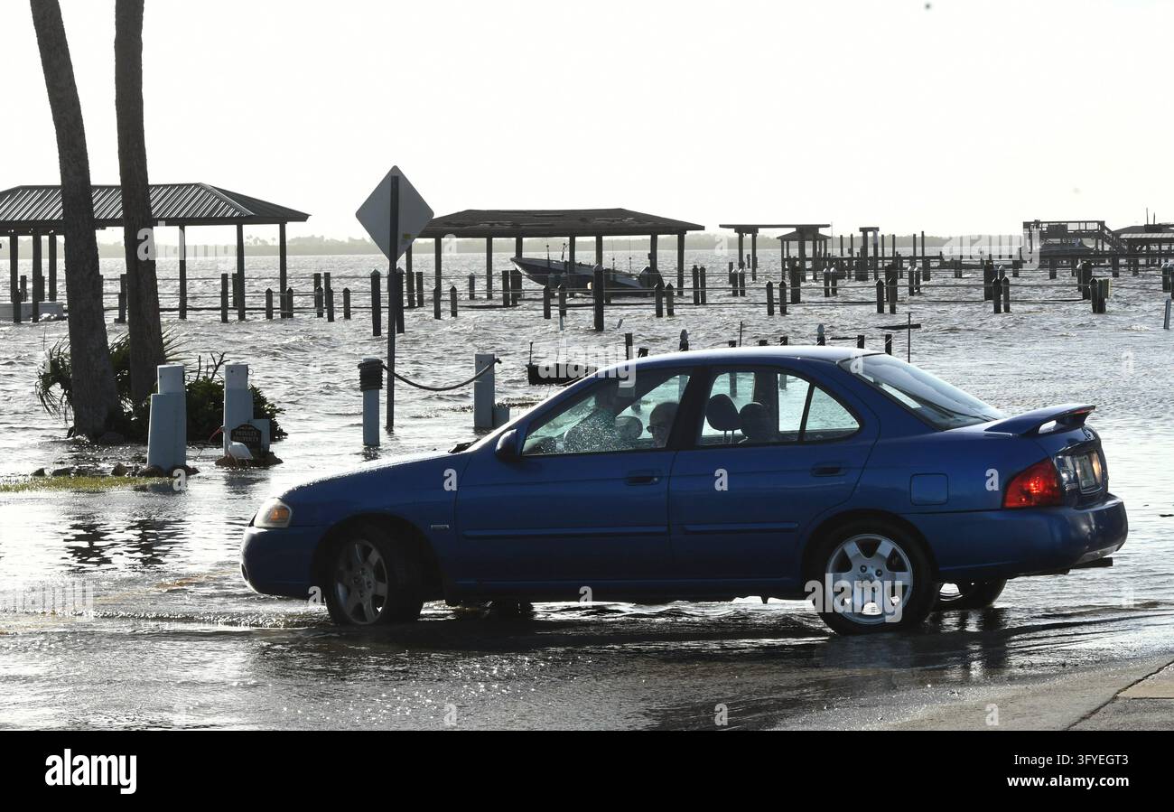 The Halifax River floods a street, causing a driver to turn around, the ...