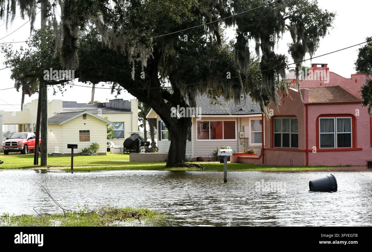 Water from the Halifax River floods a street, the result of severe king ...