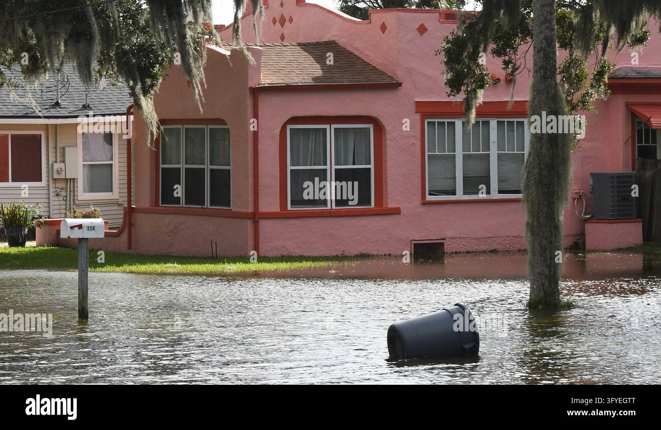 Water from the Halifax River floods a street, the result of severe king ...