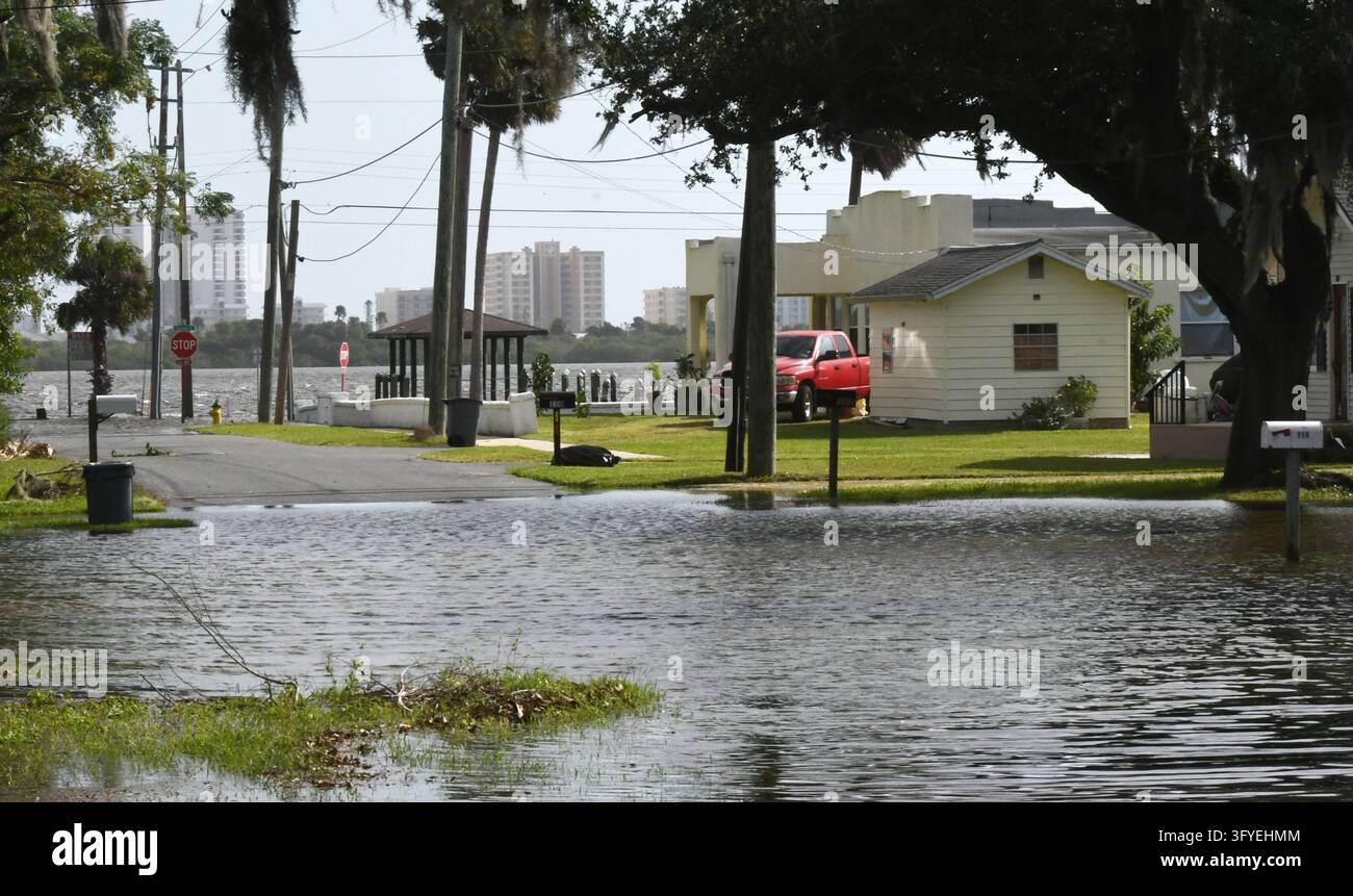 Water from the Halifax River floods a street, the result of severe king ...