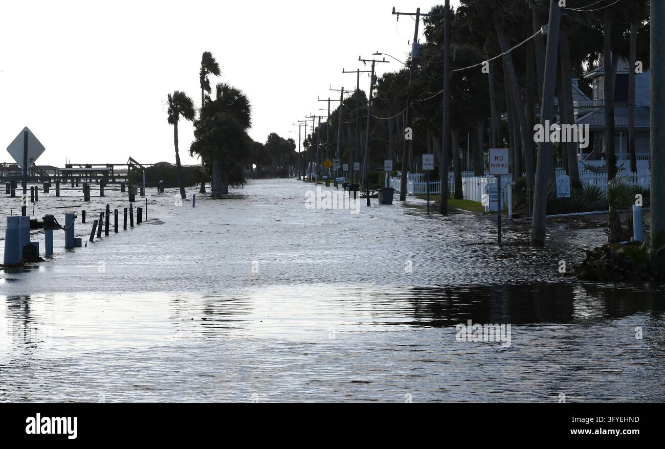 The Halifax River floods a street, the result of severe king tides ...