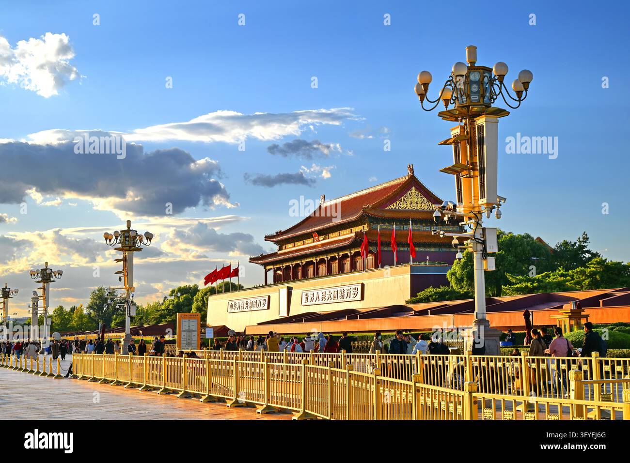 Enjoyd Tiananmen Square is seen under a clear blue sky with white clouds in ...