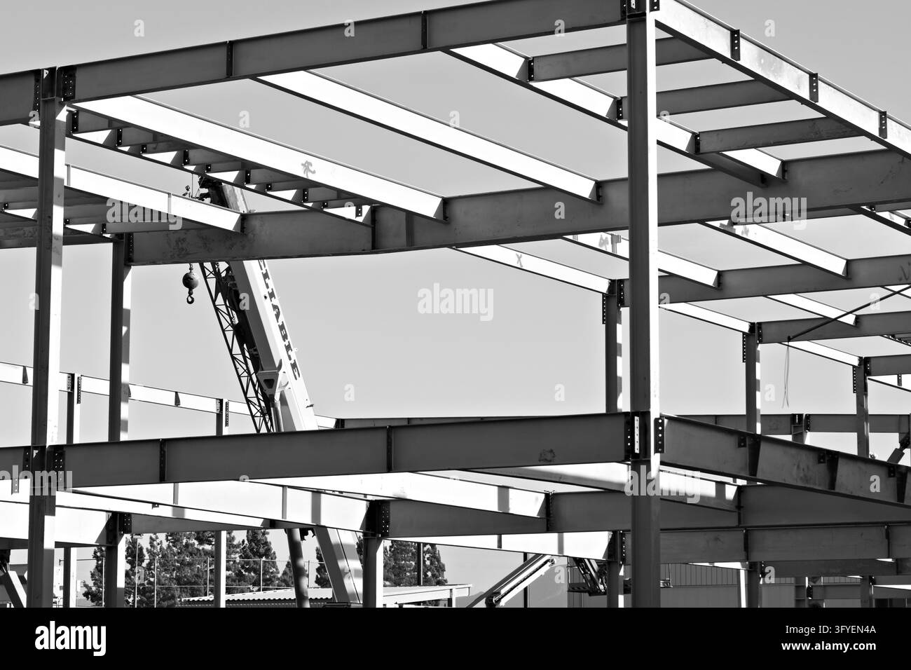 Exposed steel beams and columns form the framework of a multistory ...