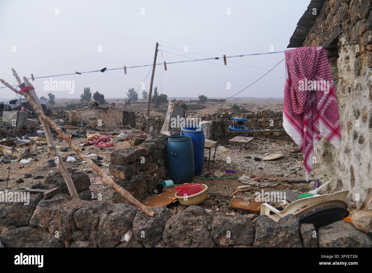 Household belongings lie scattered amid rubble after a Jordanian ...