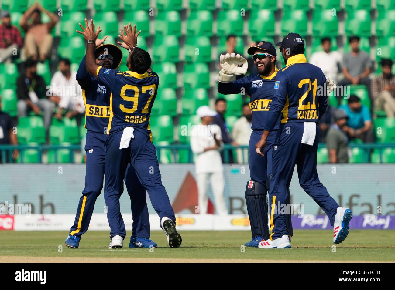 Sri Lanka's Eshan Malinga (97) celebrates with teammates after taking a ...