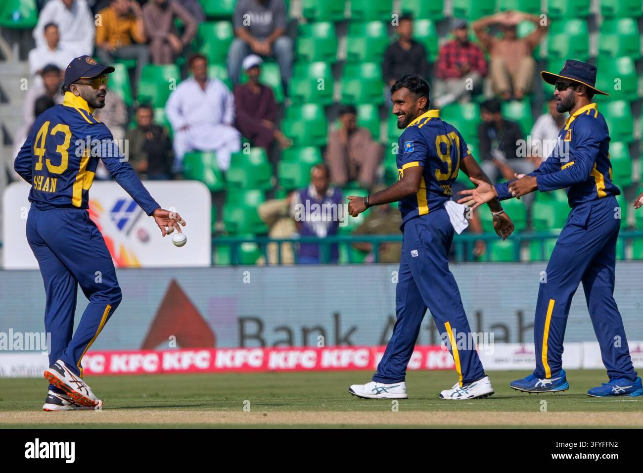 Sri Lanka's Eshan Malinga, center, celebrates with teammates after ...