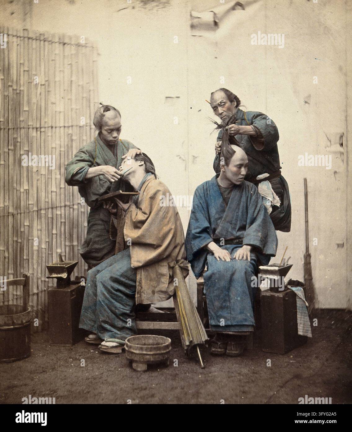 Two Japanese barbers: shaving (left), and hairdressing (right ...