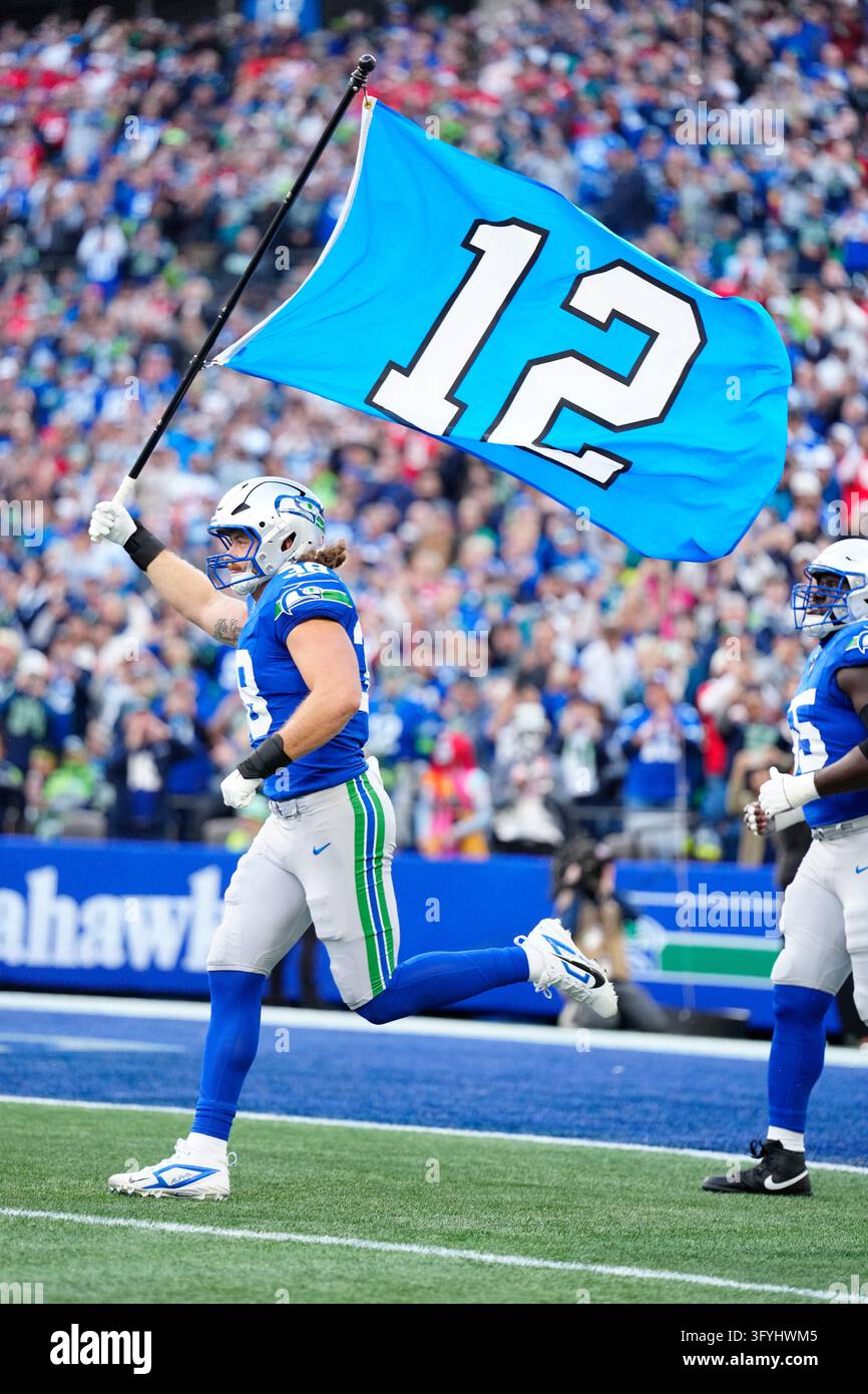 Seattle Seahawks fullback Brady Russell (38) carries the 12 flag out ...