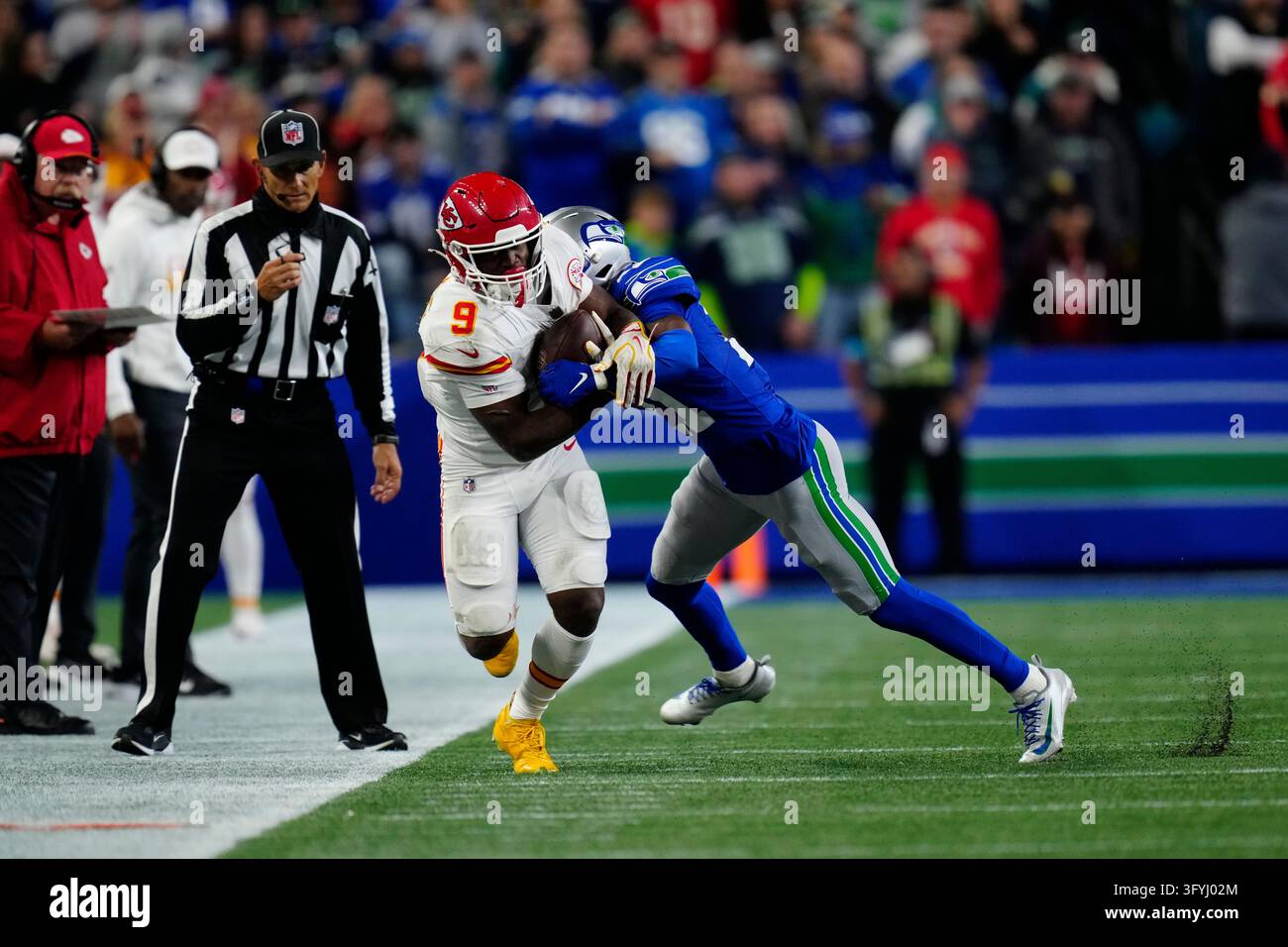 Seattle Seahawks cornerback Devon Witherspoon (21) tackles Kansas City ...