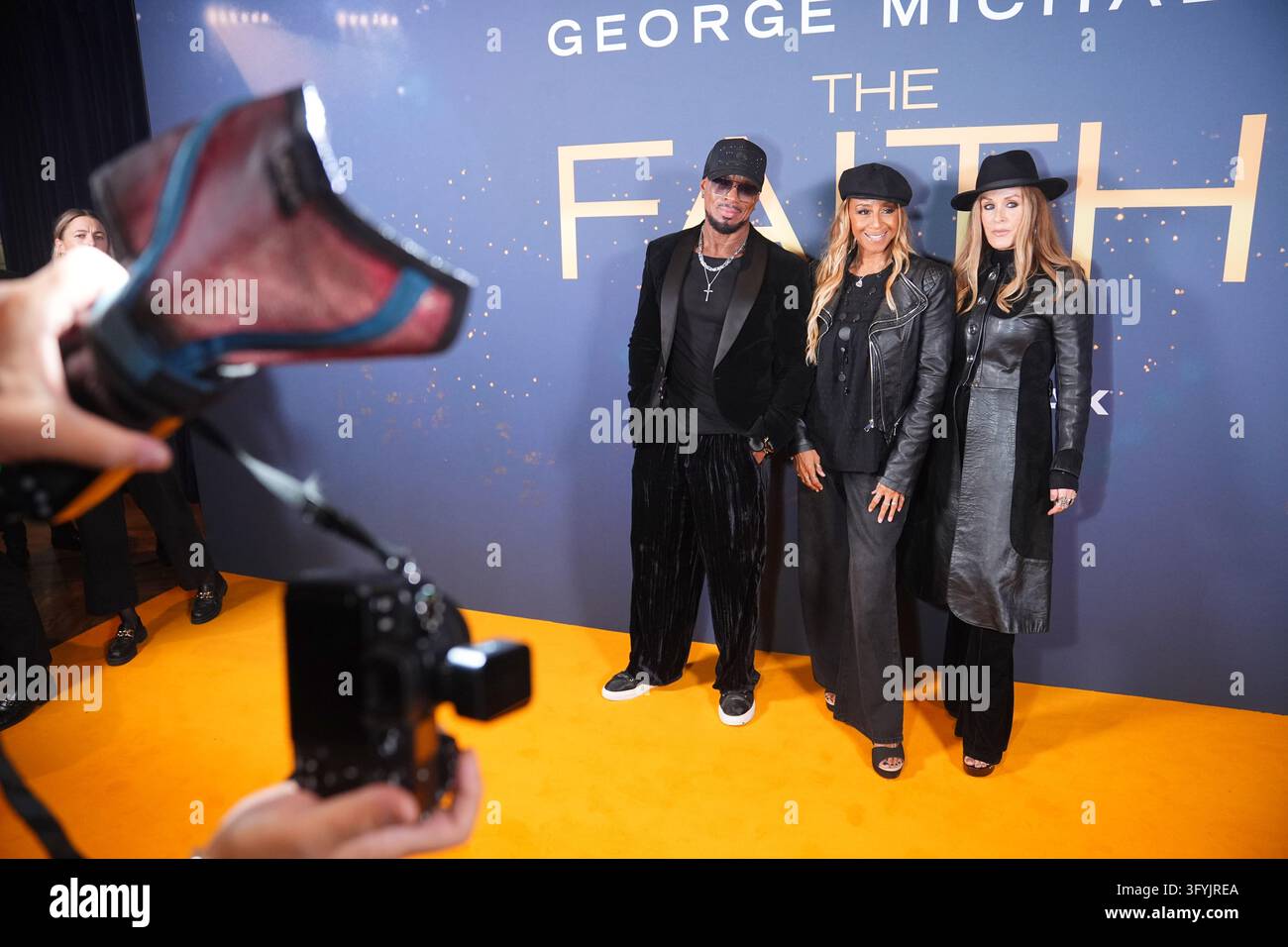 (Left to right) Jay Henry, Shirley Lewis, and Joe Garland, attend the ...