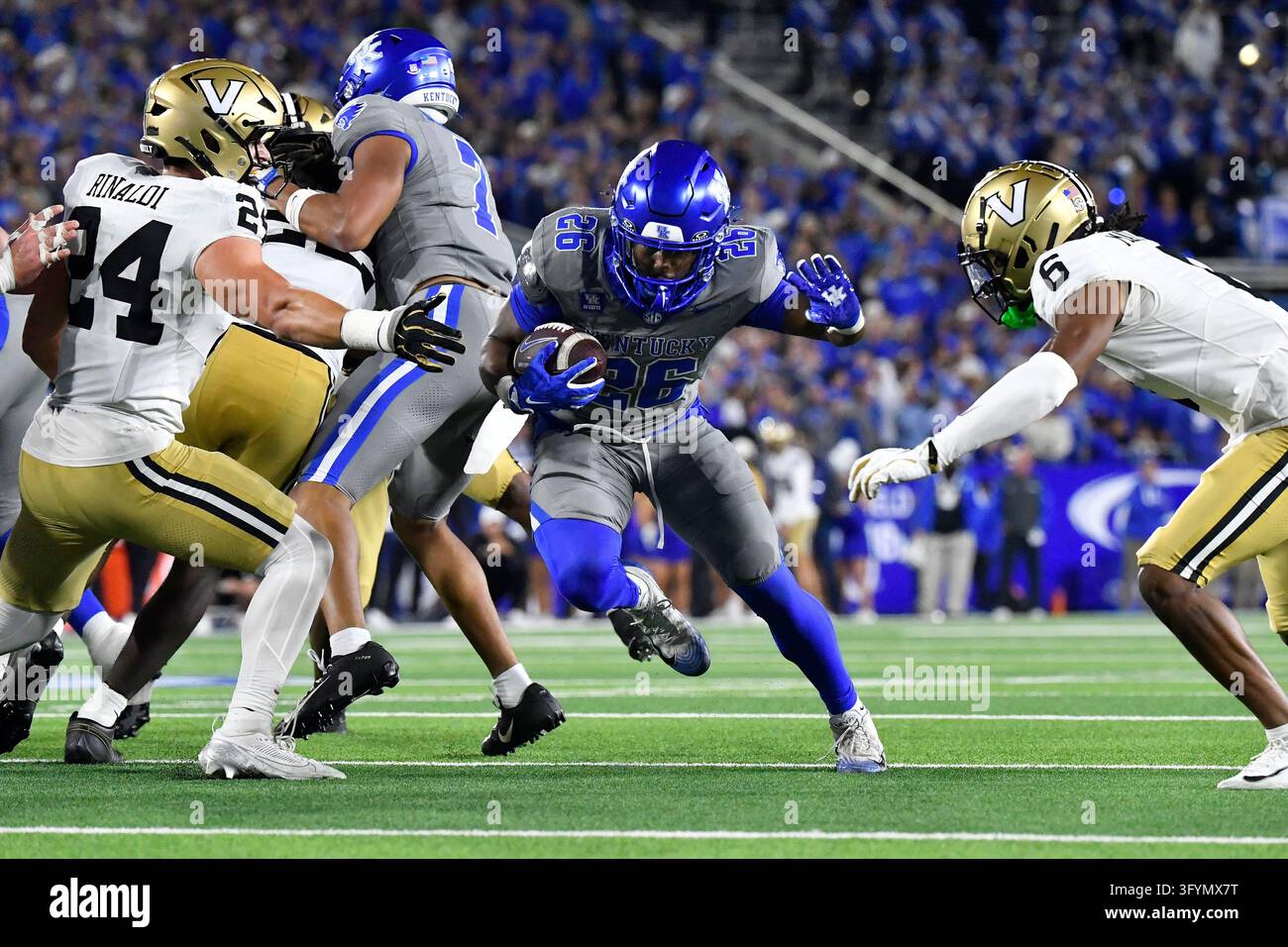 Jason Patterson Kentucky running back Jason Patterson (26) runs through an opening in ...