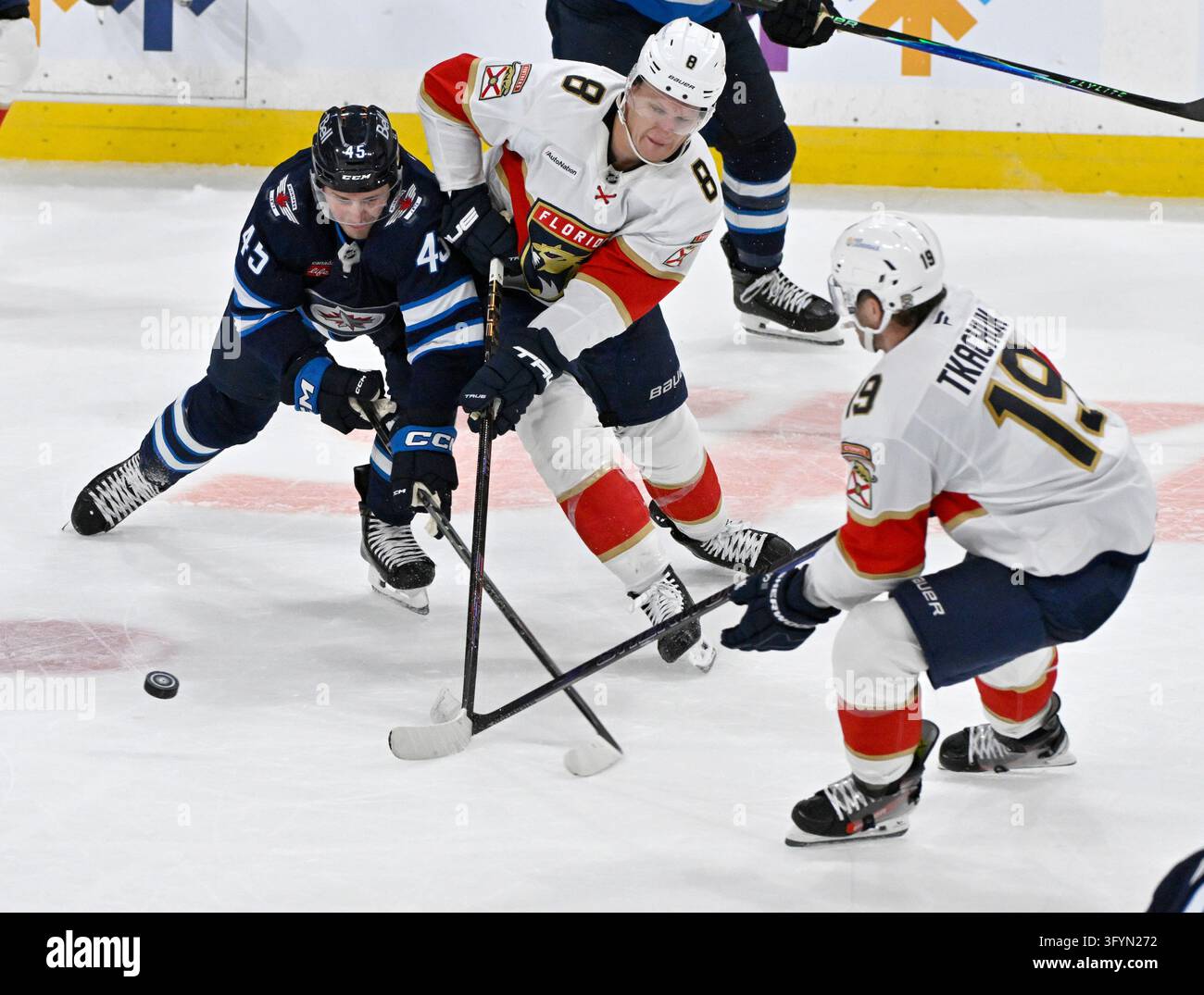 Winnipeg Jets' Cole Koepke (45) battles for the puck against Florida ...