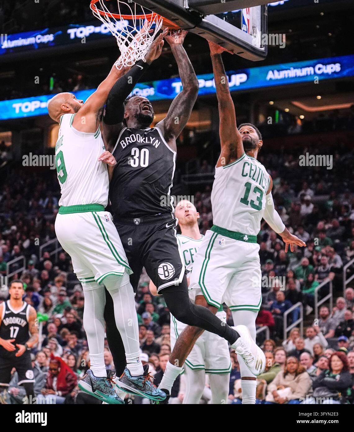 Brooklyn Nets' Julius Randle (30) drives to the basket between Boston ...