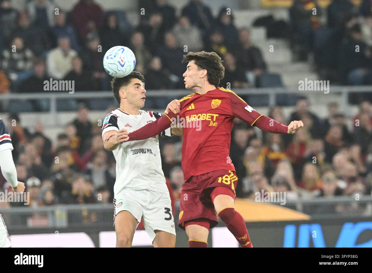 IPA90272047 - Adam Obert of Cagliari Calcio competes for the ball with ...