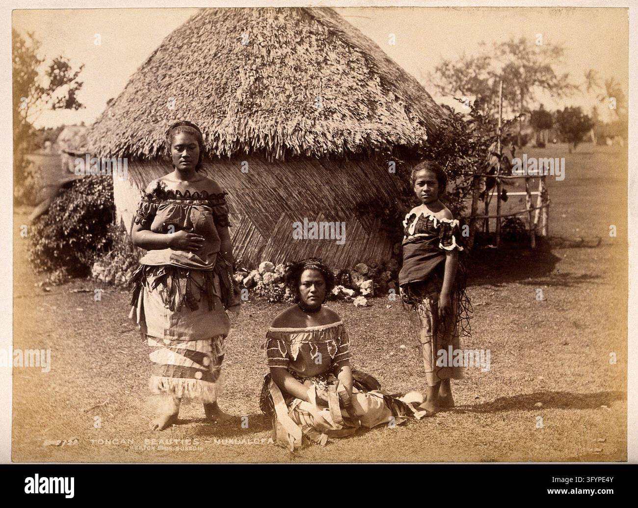 Nuku'alofa, Tonga: three Tongan women in front of a traditional hut ...