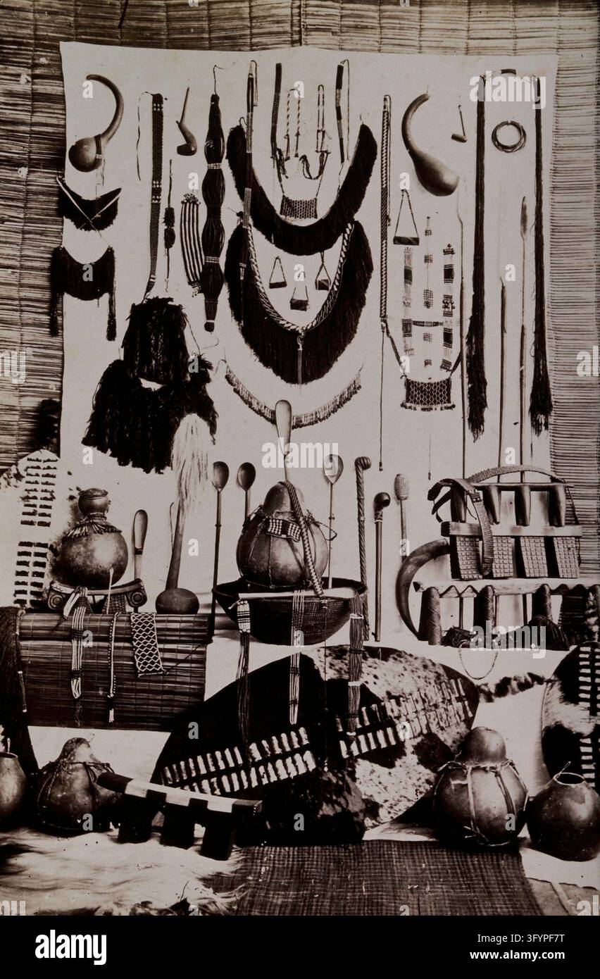 Africa: a display of Zulu shields, mats, pillows, smoking horns ...