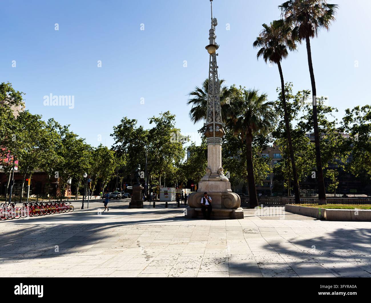 Barcelona , Spain - June 27, 2026: Monument stands in a sunny public ...