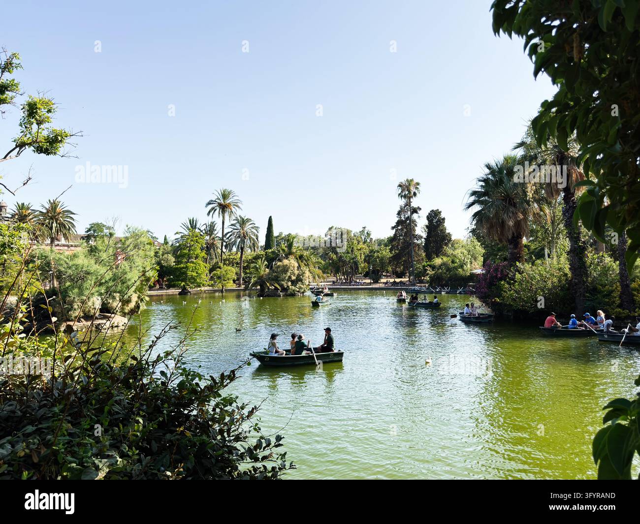 Barcelona , Spain - June 27, 2026: People enjoy boating and rowing on a ...