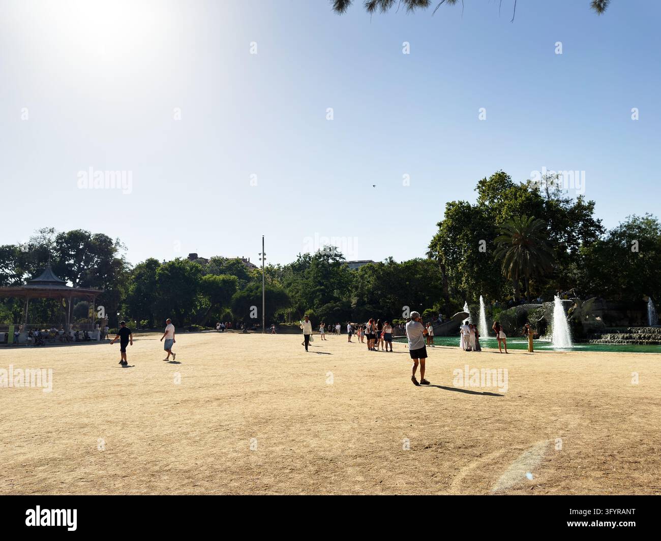 Barcelona , Spain - June 27, 2026: People walk and gather across a ...