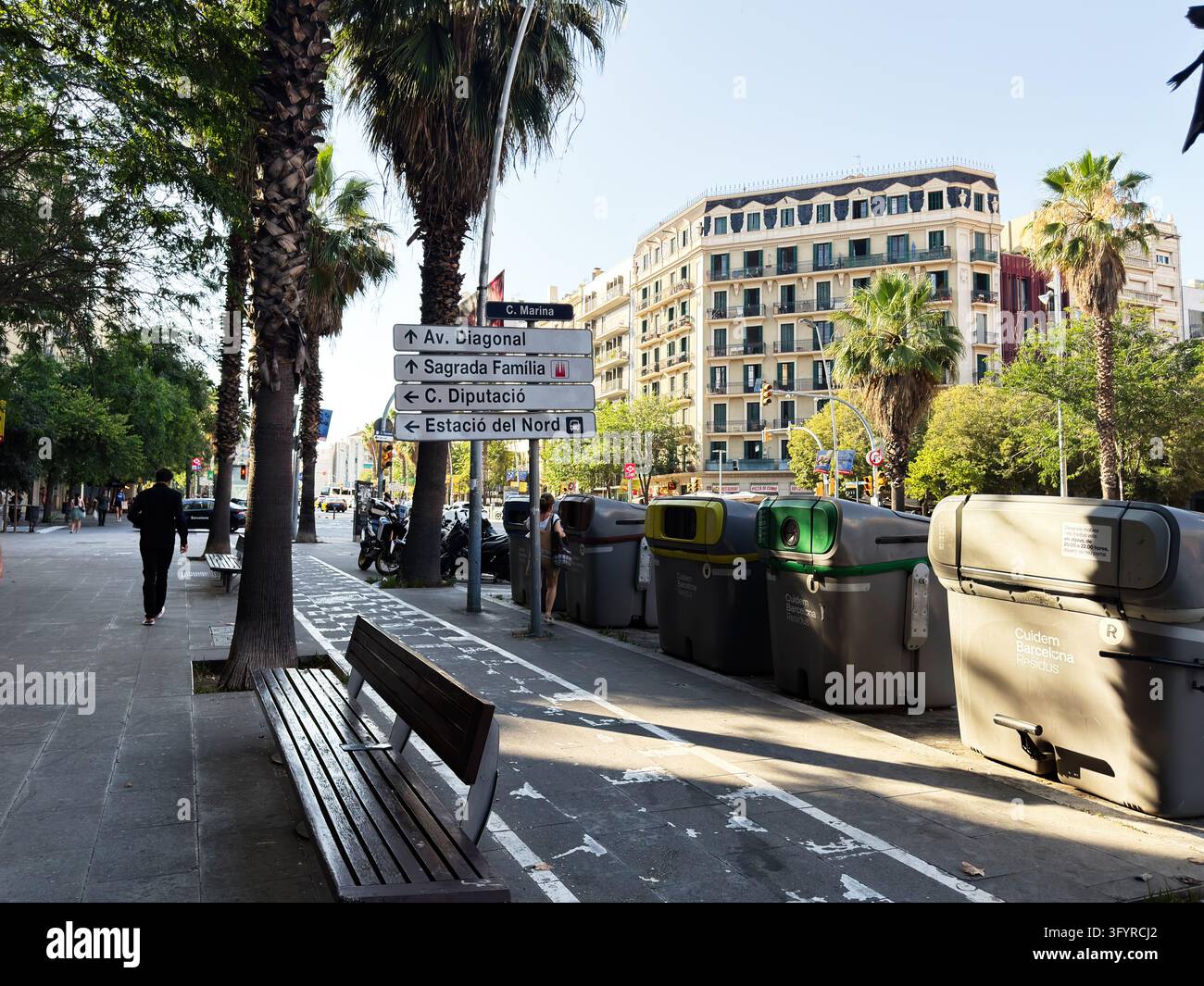 Barcelona , Spain - June 27, 2026: Barcelona street scene shows palm ...