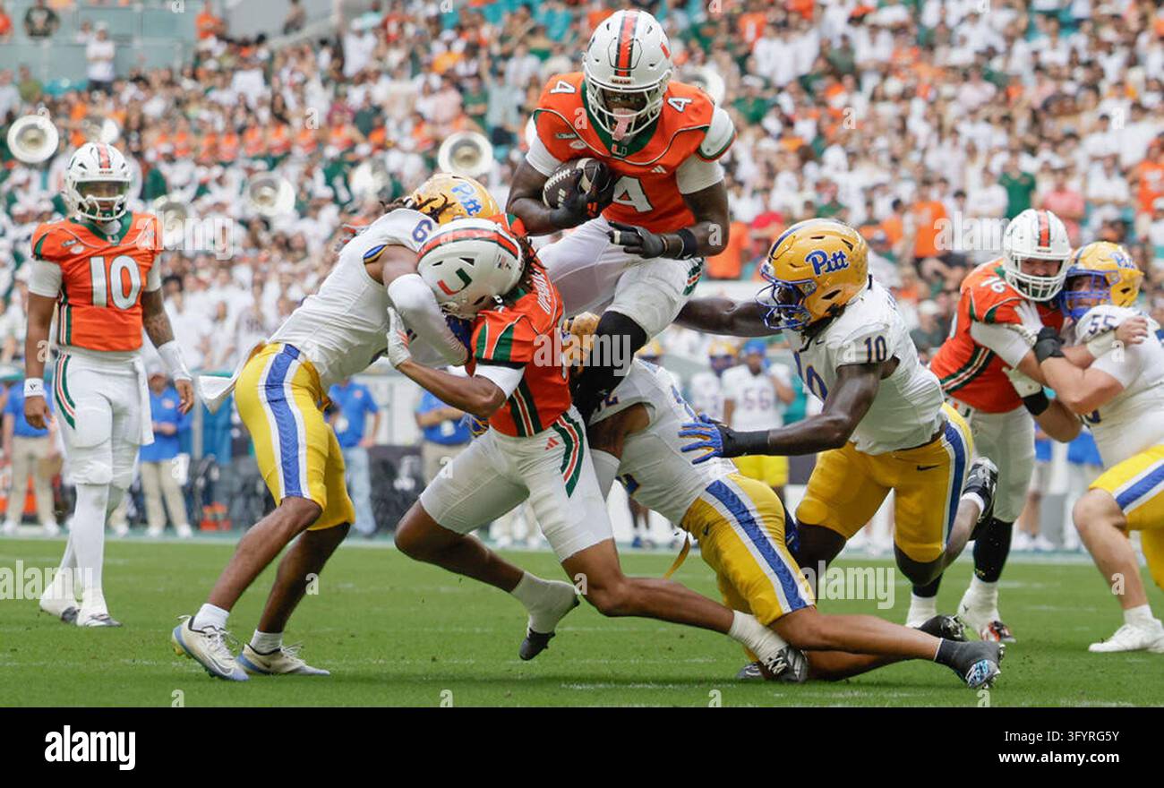 Miami Hurricanes running back Mark Fletcher Jr. (4) leaps over ...