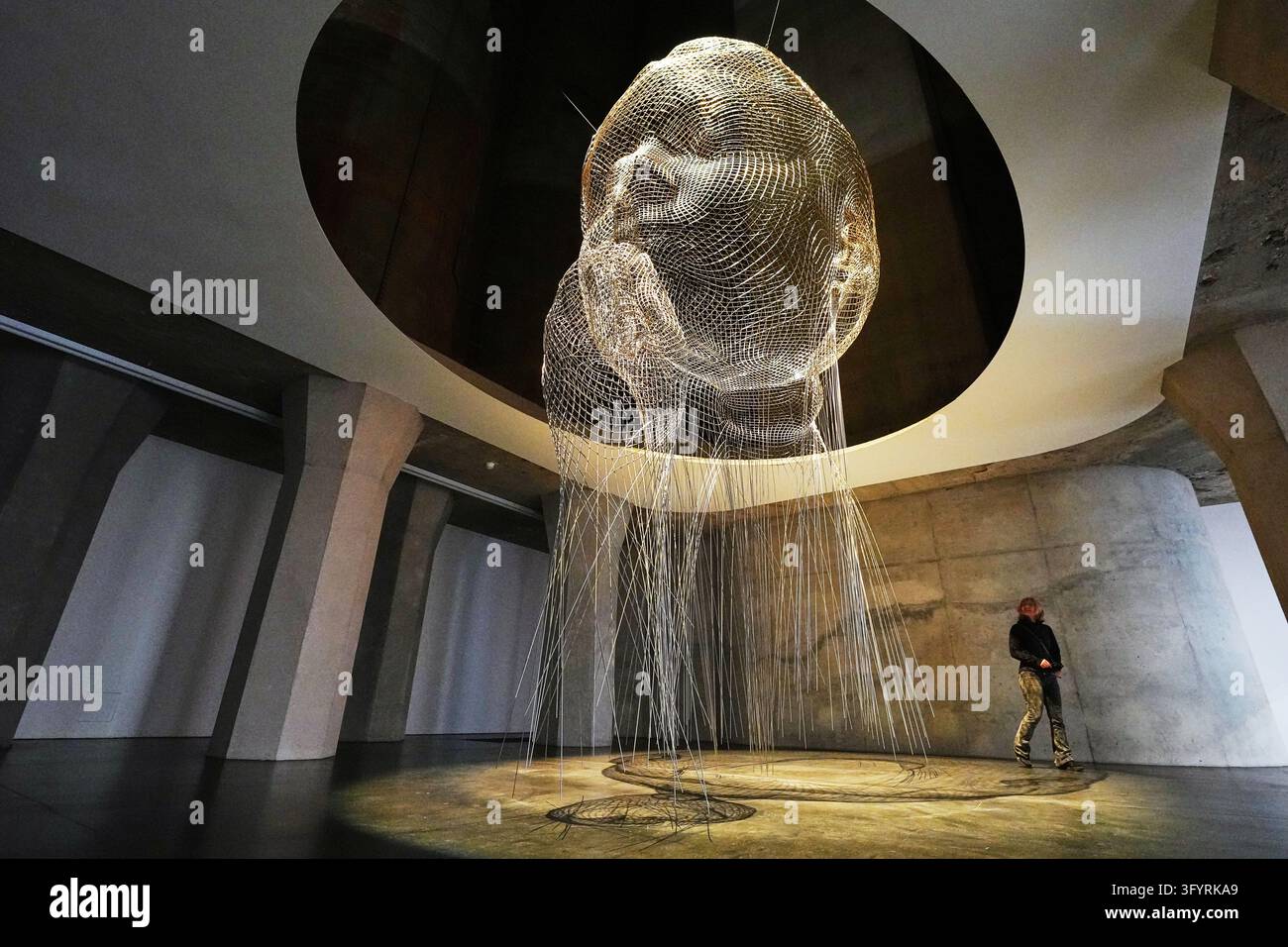 A visitor views artwork 