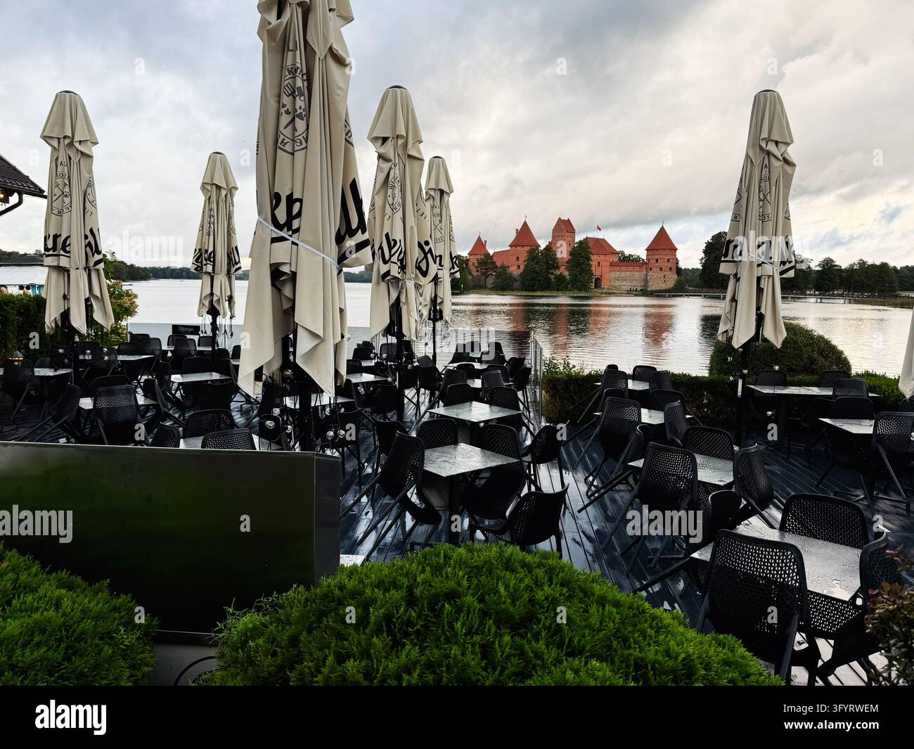 Empty Cafwe Trakai, Lithuania - October 05, 2026: Outdoor cafe terrace with empty ...