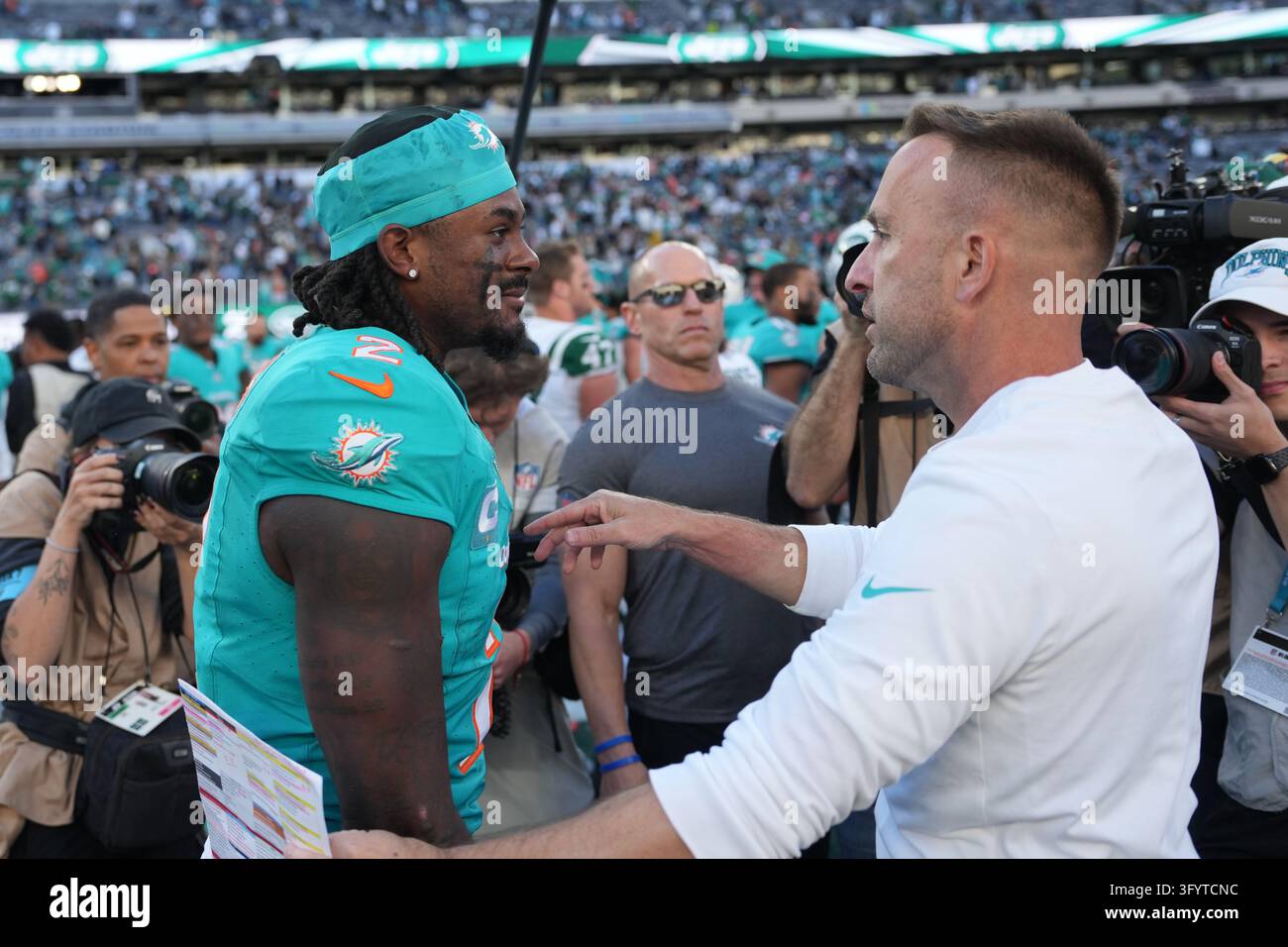 Team Hug Vector Miami Dolphins quarterback Malik Willis (2) gets a hug from Miami ...