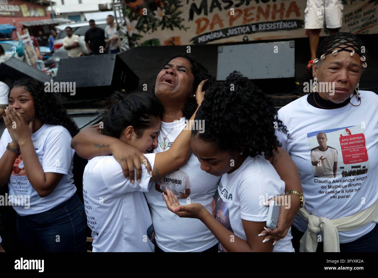 Team Hug Vector Relatives hug and cry during a demonstration marking the first ...