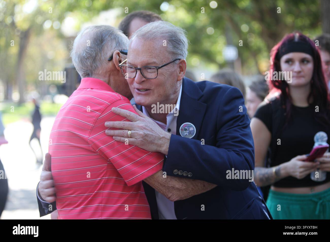 Team Hug Vector Democrat Adam Hamilton hugs a supporter of his campaign for the U.S ...