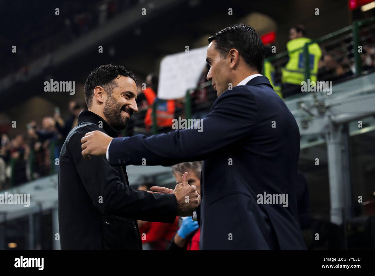 Team Hug Vector Ruben Amorim, head coach of AC Milan, hugs Raffaele Palladino, head ...
