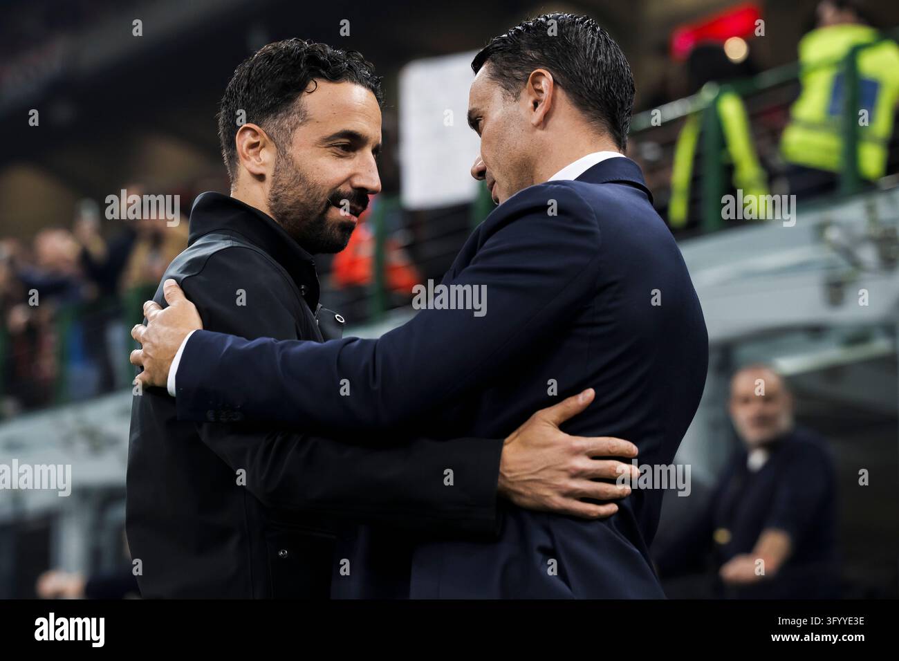 Team Hug Vector Ruben Amorim, head coach of AC Milan, hugs Raffaele Palladino, head ...