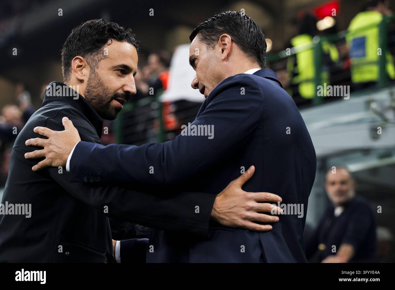 Ruben Amorim, head coach of AC Milan, hugs Raffaele Palladino, head ...