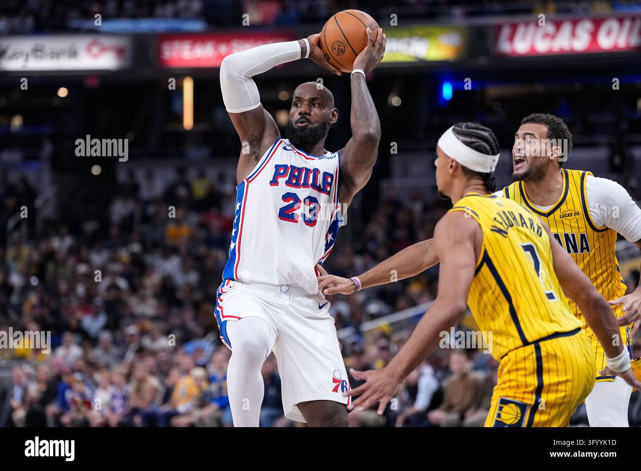 Philadelphia 76ers forward LeBron James (23) makes a pass over Indiana ...