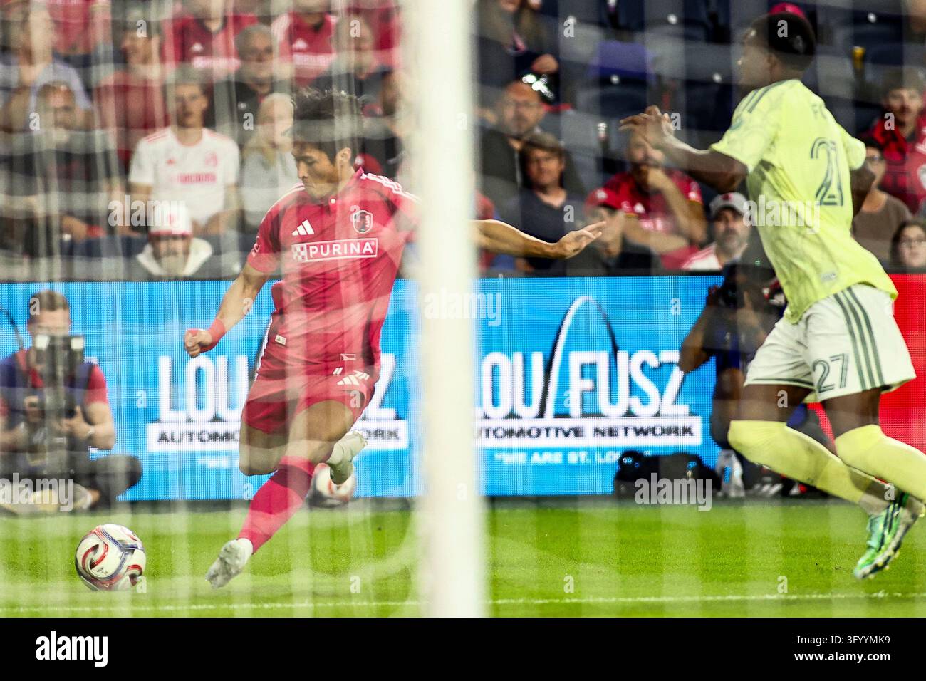 Between The Box Jeong Sangbin (77) of St. Louis City SC crosses it into the box during ...