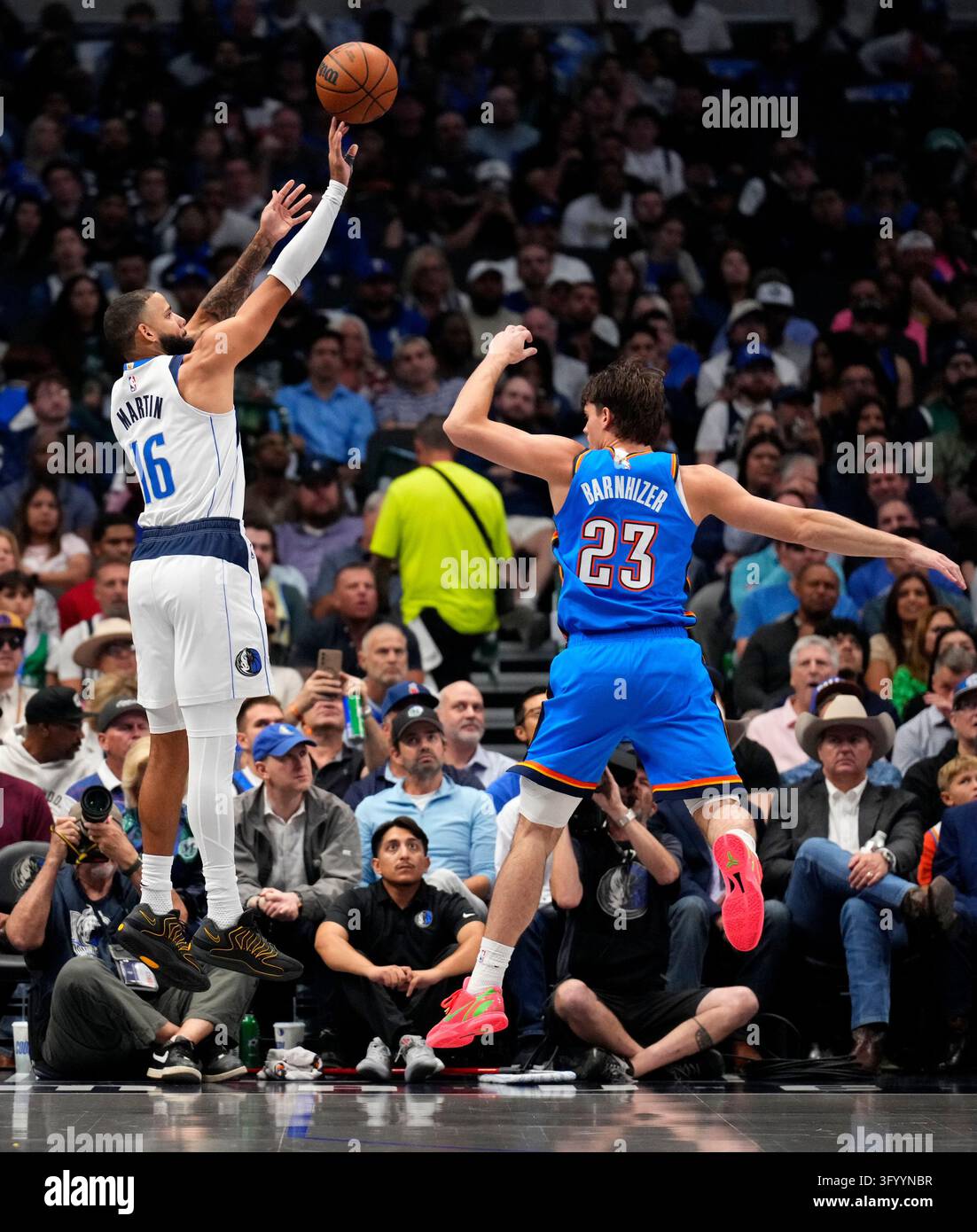 Dallas Mavericks forward Caleb Martin shoots over Oklahoma City Thunder ...