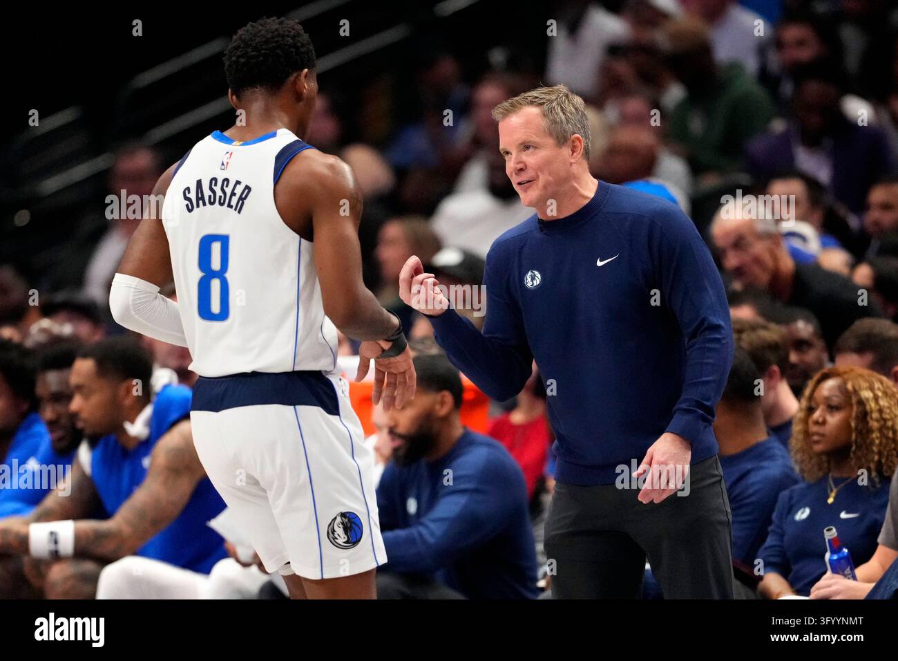 Dallas Mavericks head coach Dusty May talks with guard Marcus Sasser ...