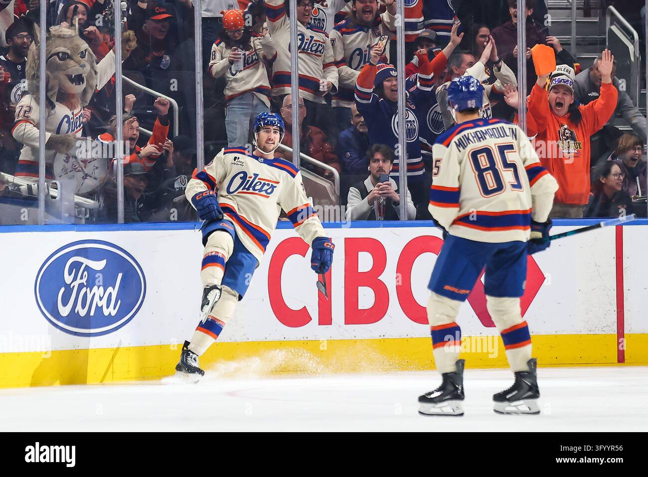 Edmonton Oilers' Alex Formenton, left, celebrates a goal against the ...