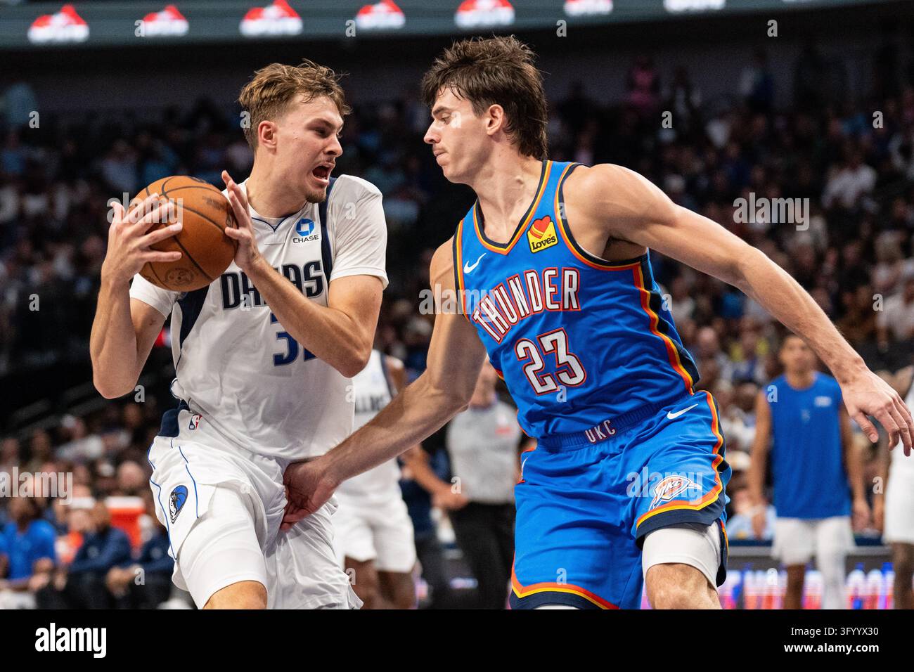 Dallas Mavericks forward Cooper Flagg tries to drive past Oklahoma City ...