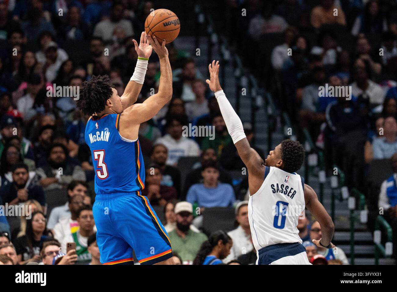 Oklahoma City Thunder guard Jared McCain shoots over Dallas Mavericks ...