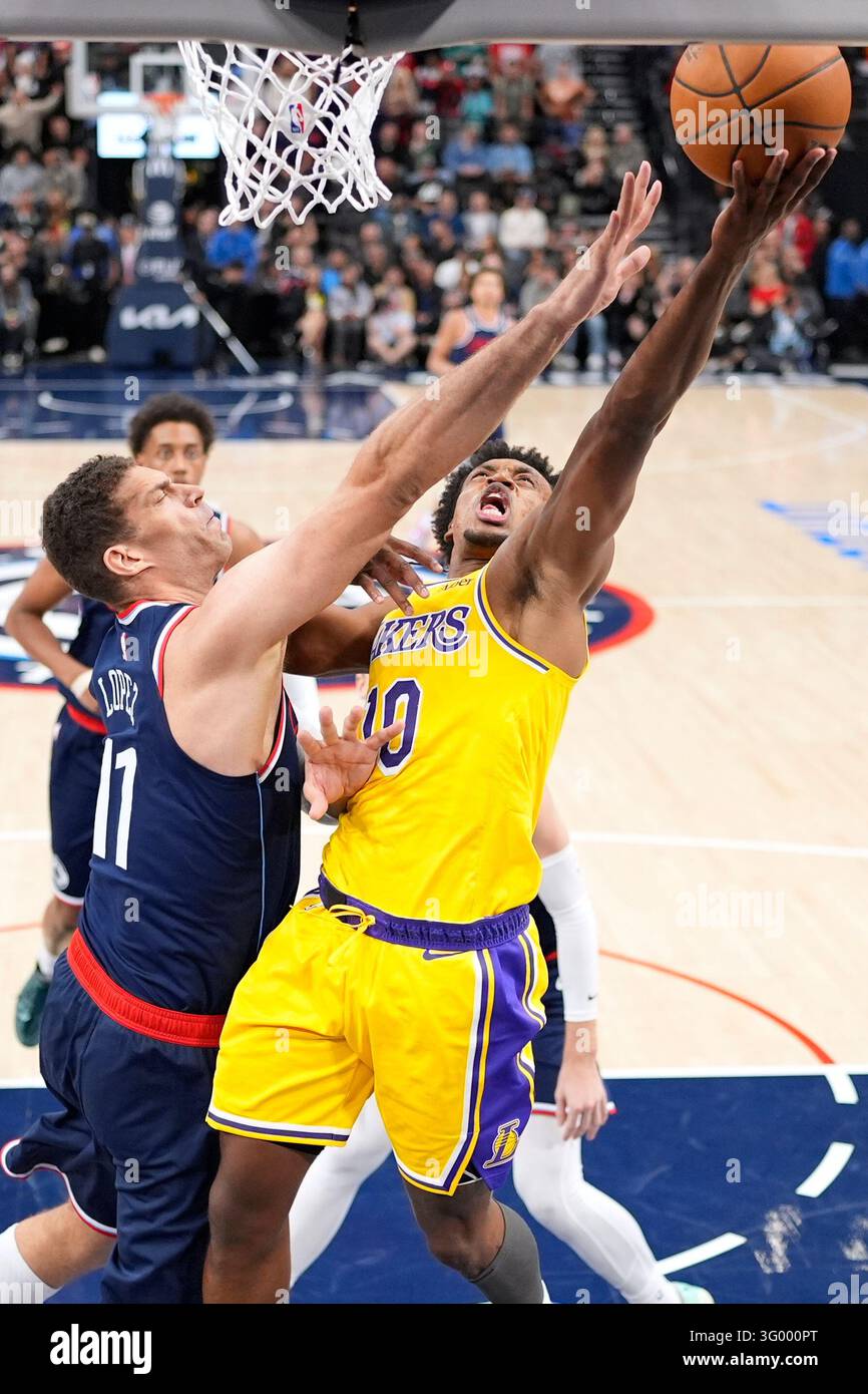 Brook Vector Los Angeles Lakers guard Collin Sexton, right, shoots as Los Angeles ...