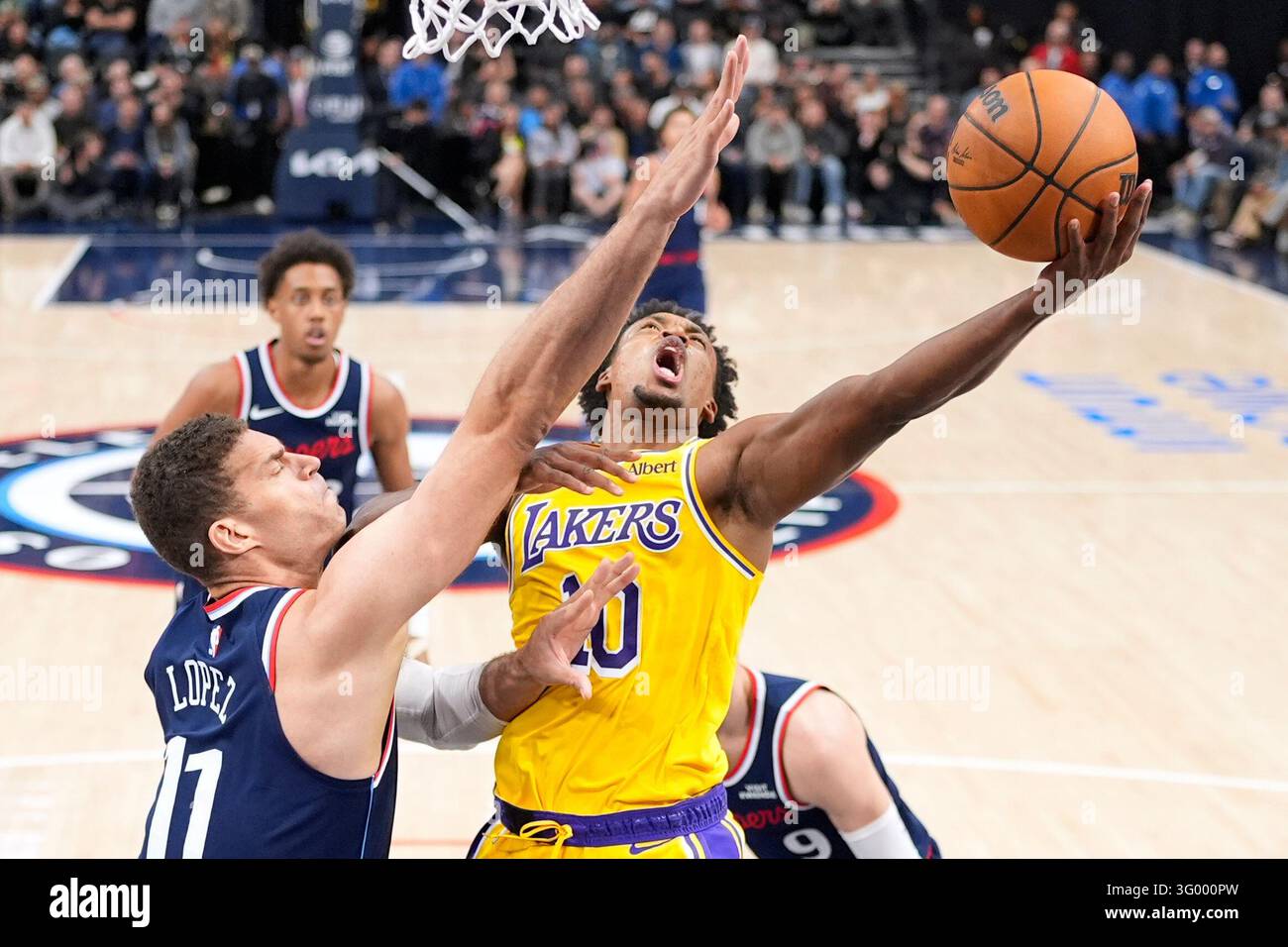 Brook Vector Los Angeles Lakers guard Collin Sexton, right, shoots as Los Angeles ...