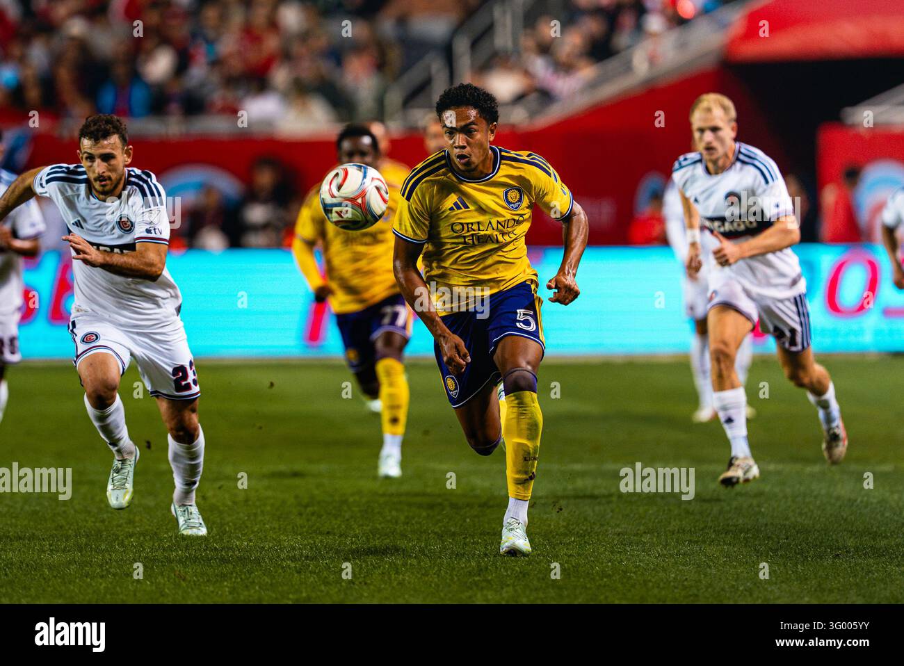 Orlando City SC midfielder Luis Otávio (5) runs forward with the ball ...