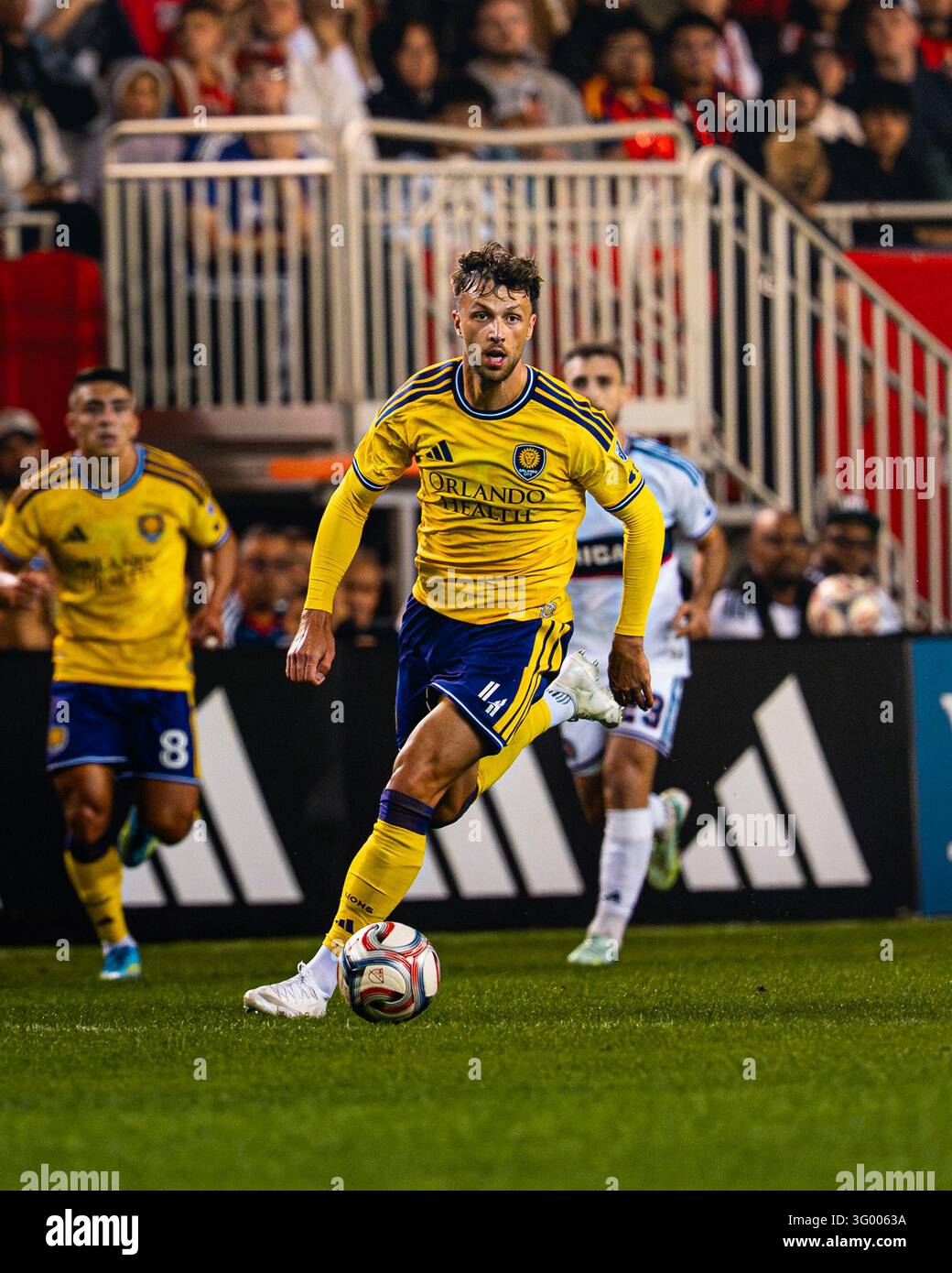 Orlando City SC defender David Brekalo (4) dribbles forward with the ...