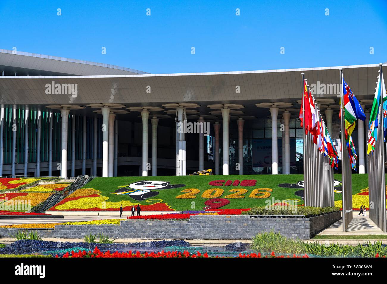 Floral displays featuring mascot Jinbao are set up at the south square ...