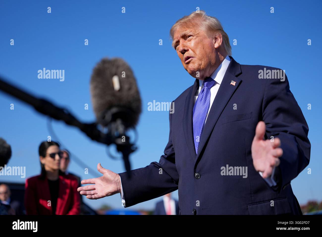President Donald Trump speaks with reporters before boarding Air Force ...