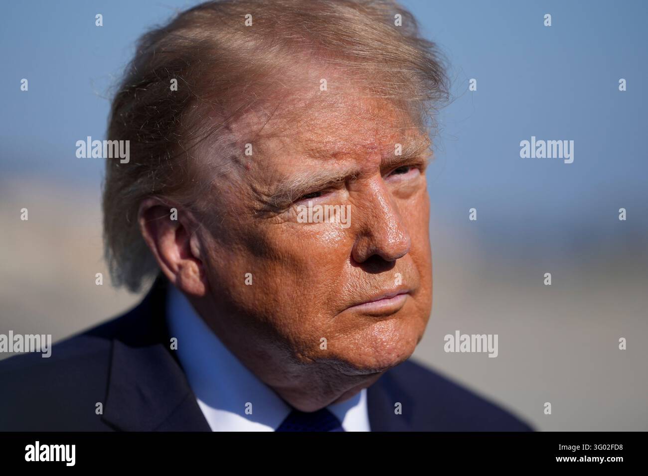 President Donald Trump speaks with reporters before boarding Air Force ...