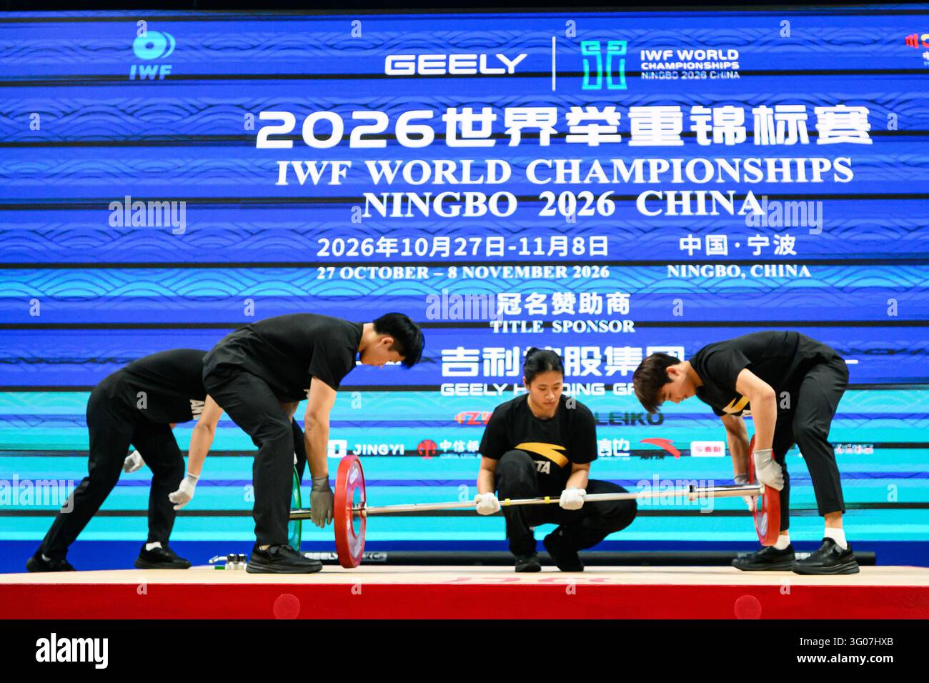 Loaders prepare the babble of the Women 57 kg Clean and Jerk during the ...